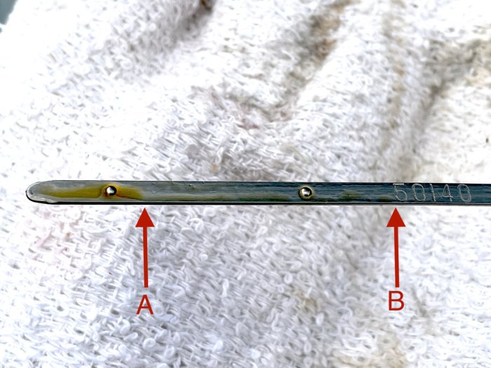 How to read oil dipstick with 2 holes